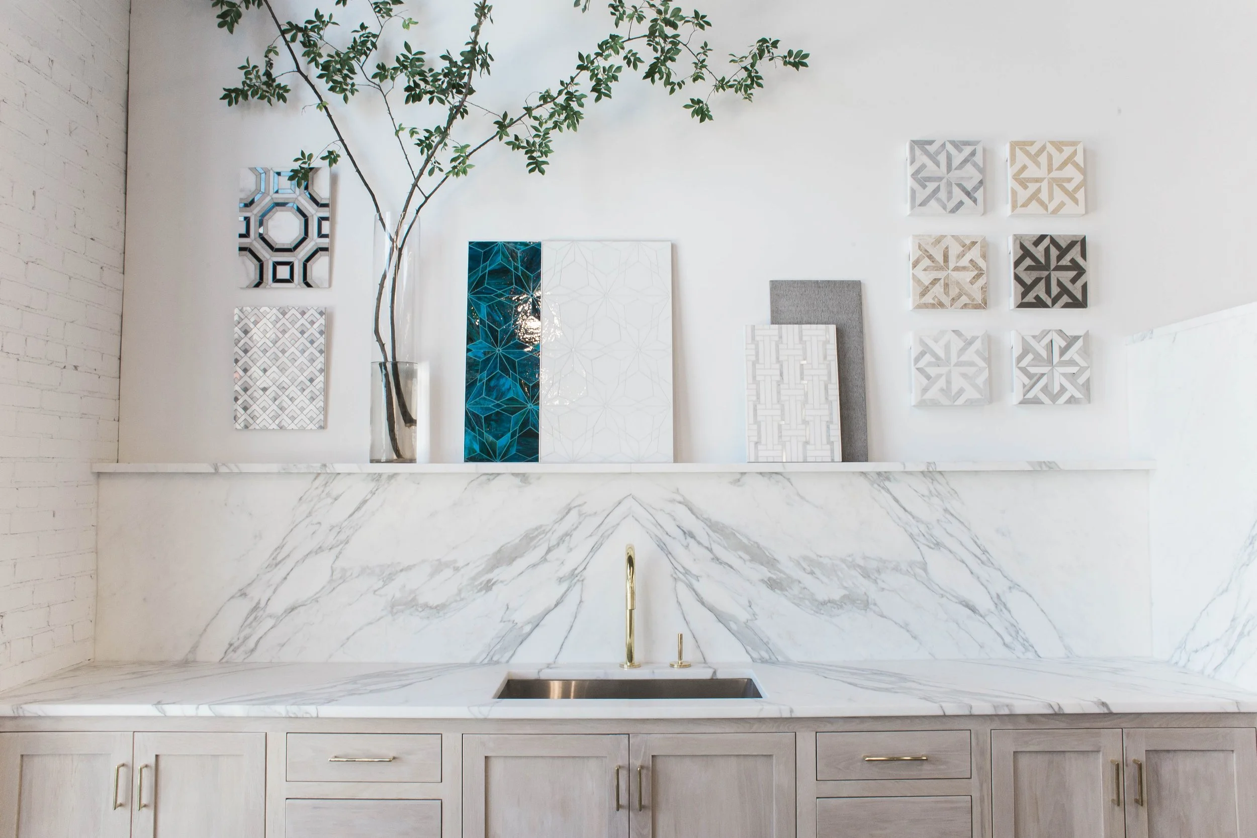 Cottage Supply interior material display with tile, cabinetry, countertop, and flooring finishes